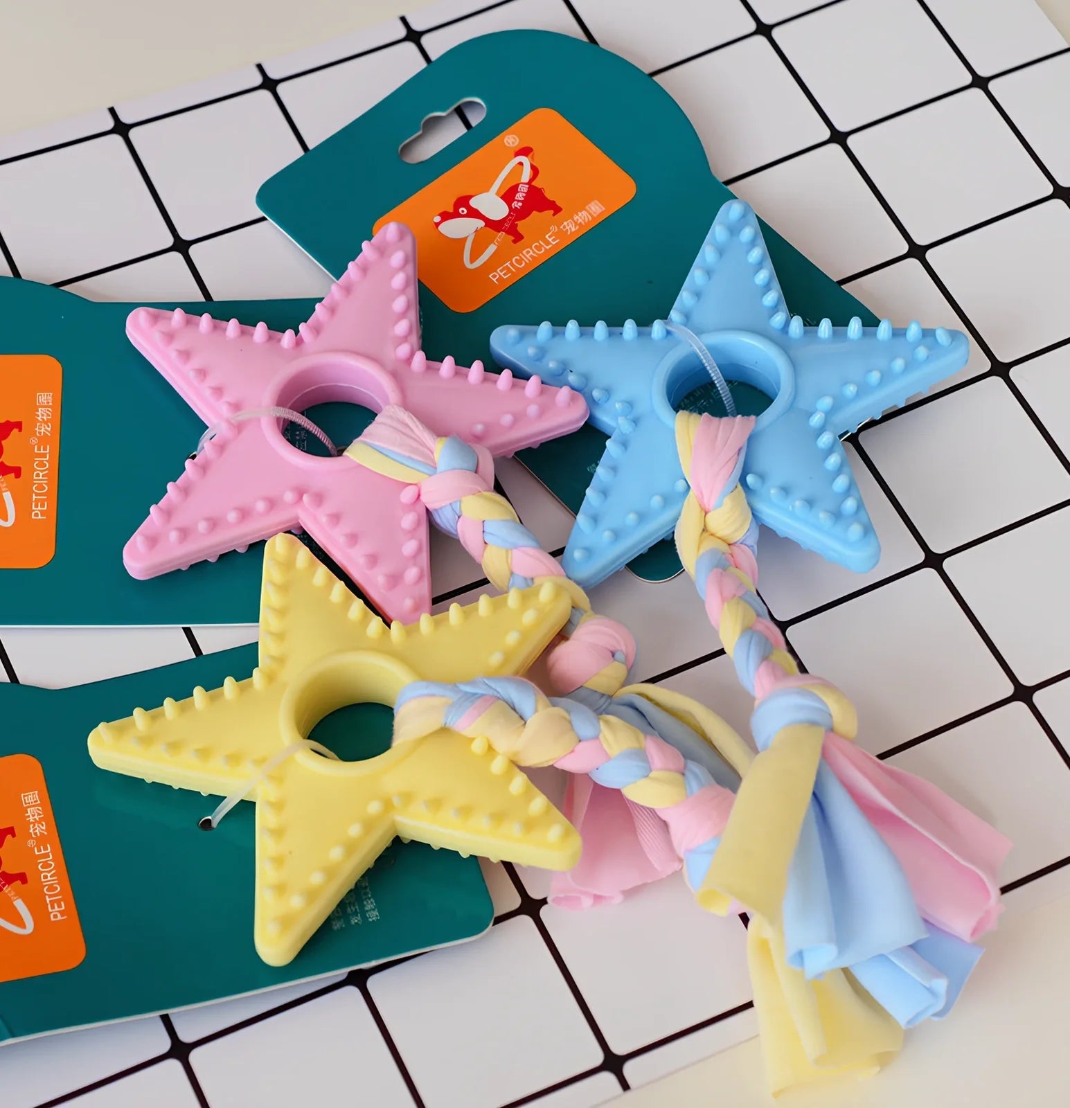 Non-toxic rubber dog chew toys in star, ring and ball shapes with textured cleaning surface