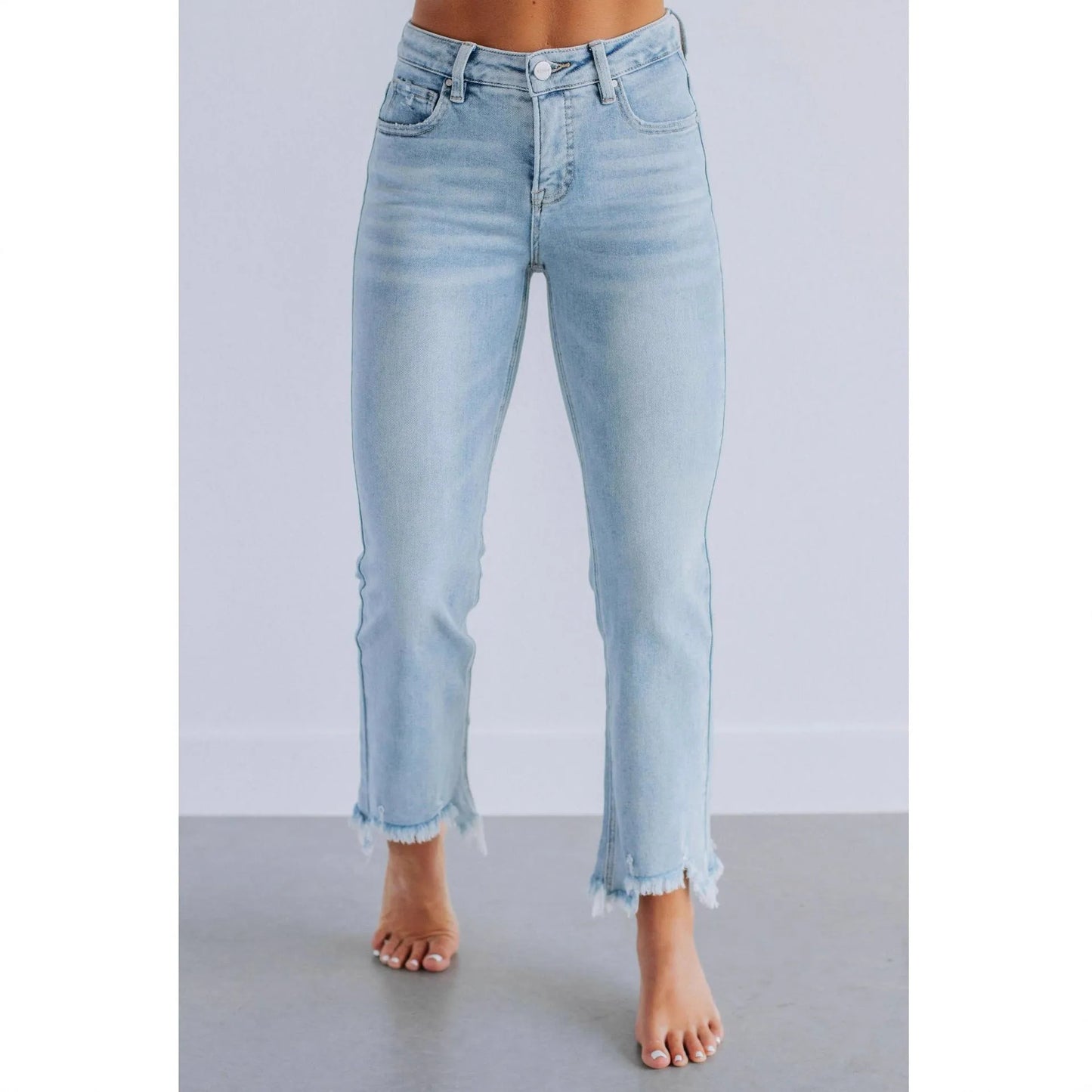 Women's solid colour denim trousers with hand-worn finish in dark blue, showing casual styling and 100% cotton construction