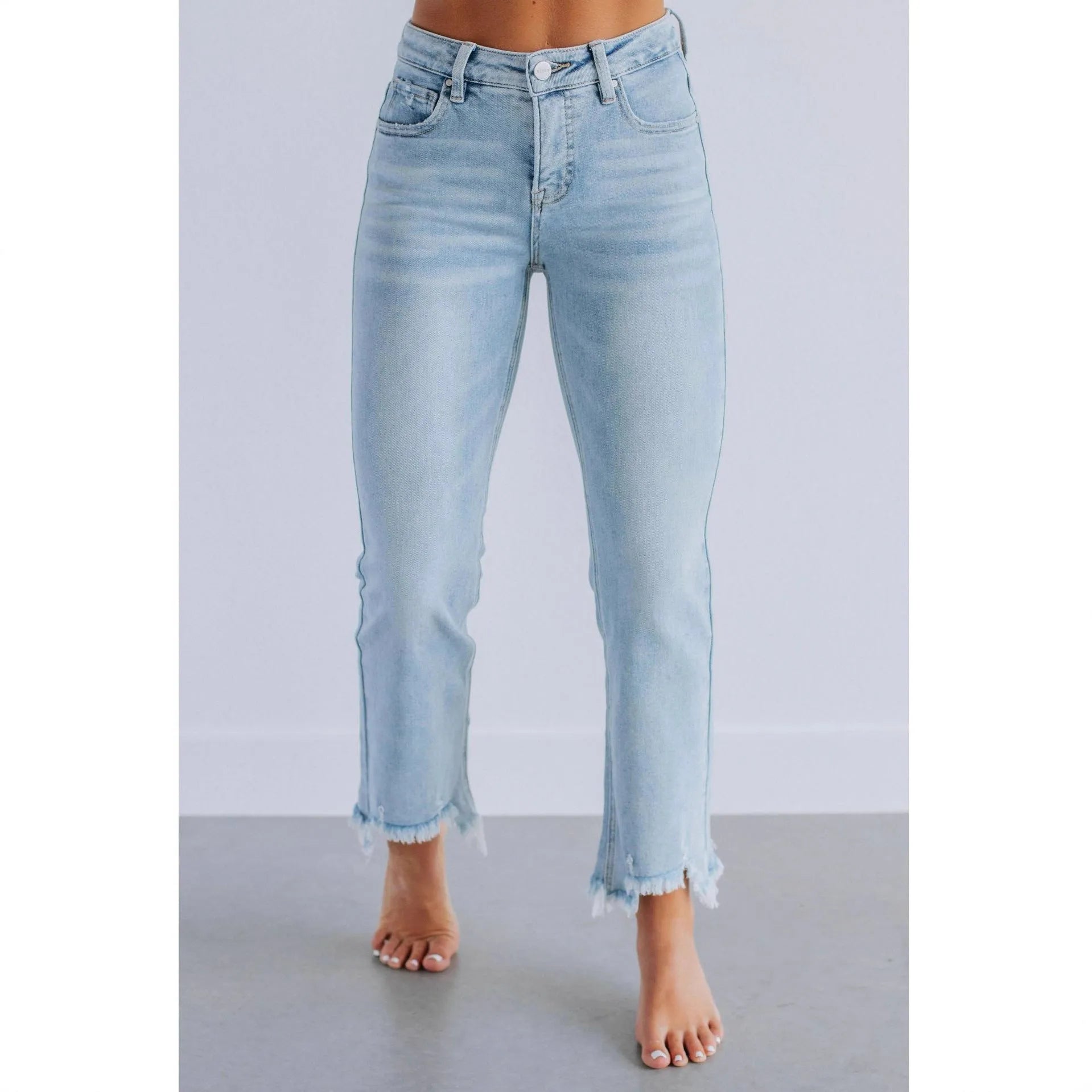 Women's solid colour denim trousers with hand-worn finish in dark blue, showing casual styling and 100% cotton construction