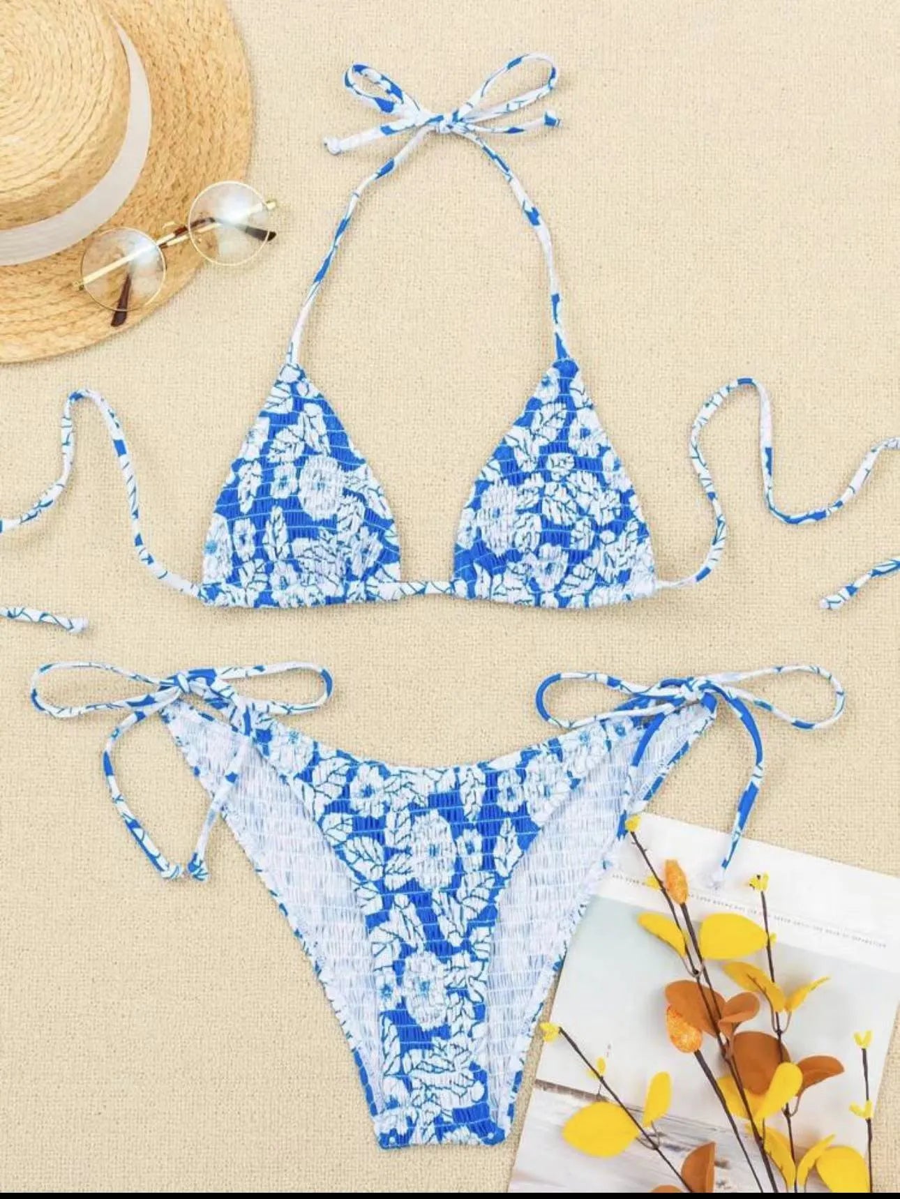 Women's floral halter neck swimsuit set in polyester fabric showing bra top and briefs