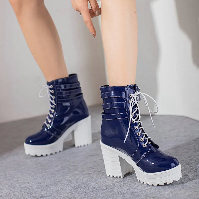 Women's black chunky heel ankle boots with round toe and front lace-up on a waterproof platform sole.