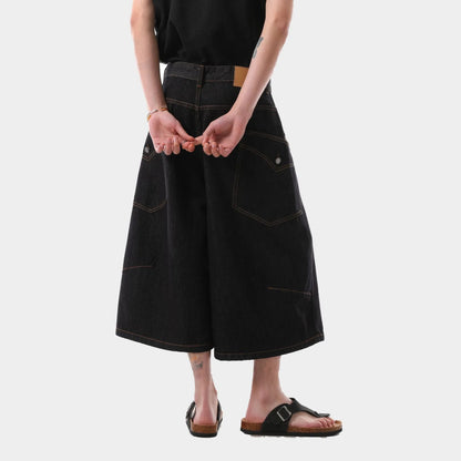 Men's black retro washed denim cropped pants with straight legs and side pockets laid flat