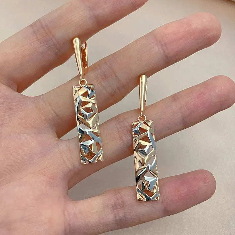 Hollow stud earrings with rectangular geometry and two-tone electroplated finish, a modern geometric style suitable for daily wear and available in a picture-style colour variation, each pair supplied as one set of alloy earrings.