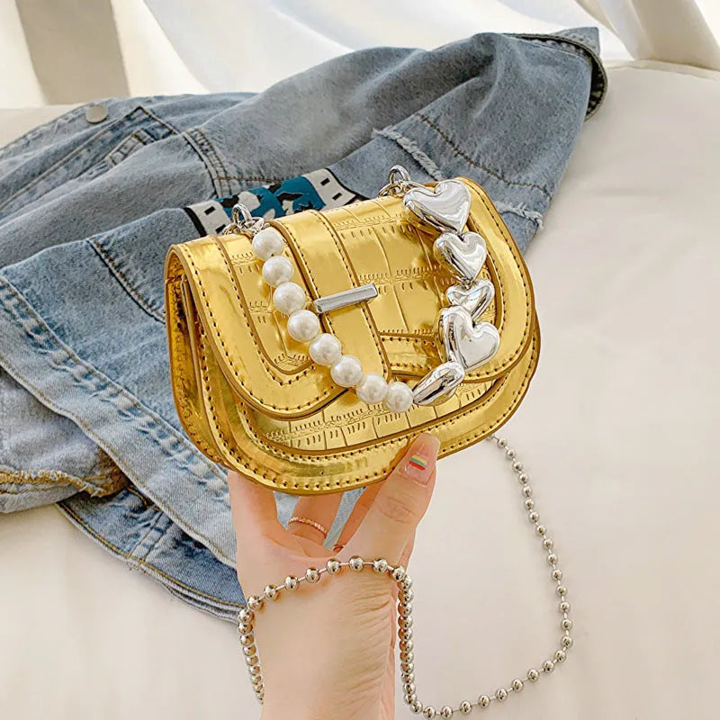 Laser Pearl Tote Saddle Girl Mini crossbody bag in black with sandwich pocket design and adjustable strap