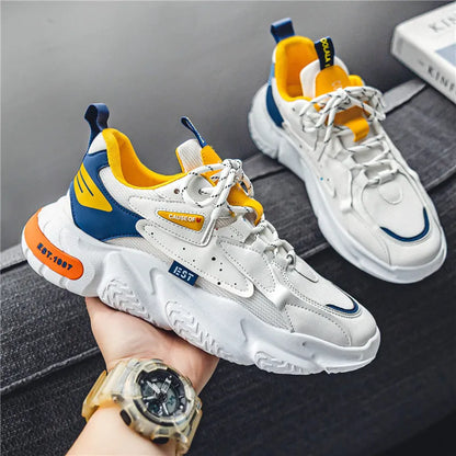 Men's low top casual pumps with 3-5cm mid heel, round toe, rubber sole, in white orange, white grey, or white blue.