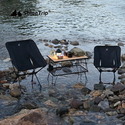 Aluminium alloy folding moon chair in outdoor setting with Oxford cloth seating and foldable frame