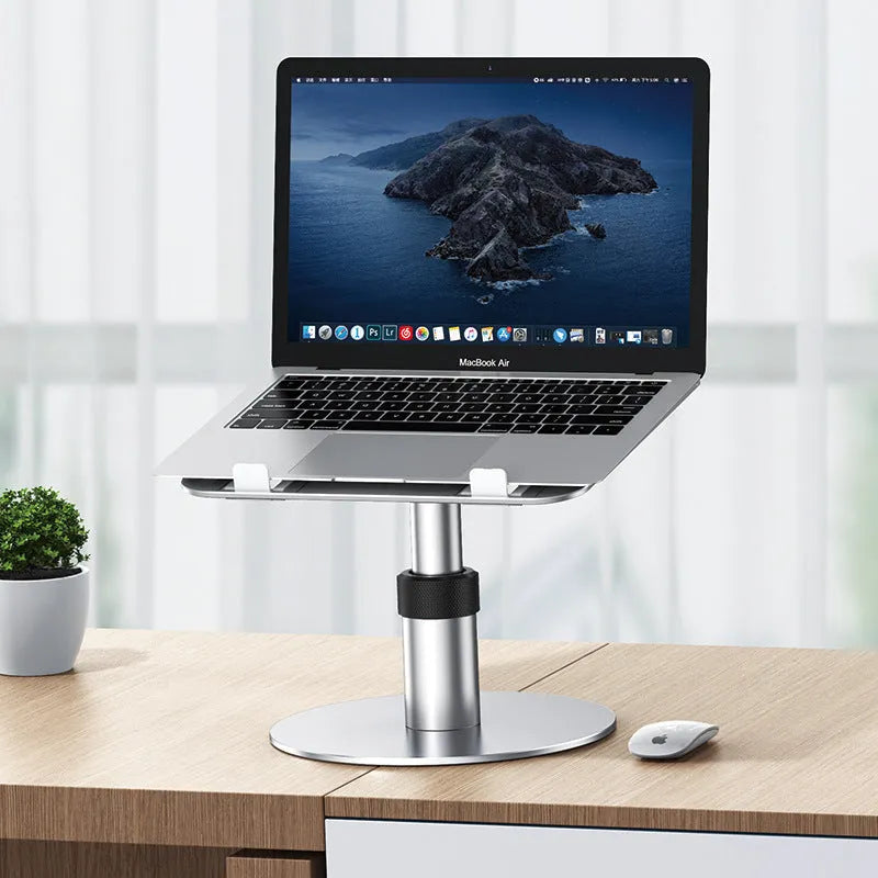 Silver adjustable aluminium car laptop stand with rotating base shown holding a laptop
