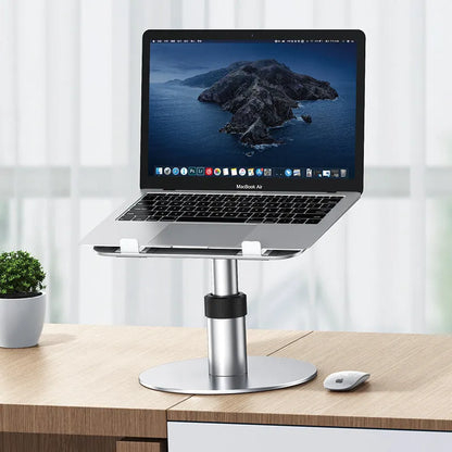 Silver adjustable aluminium car laptop stand with rotating base shown holding a laptop