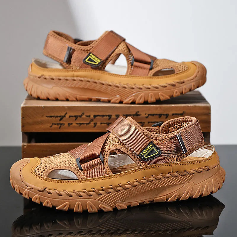 Men's grey casual sandals with hollow mesh upper, elastic band, and rubber sole.