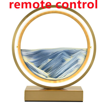 Black and white quicksand table lamp, 295mm tall with LED lights and remote control, coloured sand in glass chamber