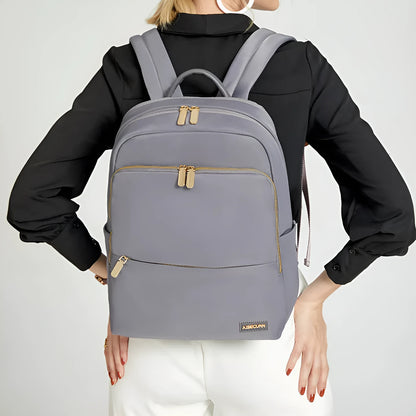 Oxford cloth women's backpack in black or purplish grey showing large capacity and padded straps