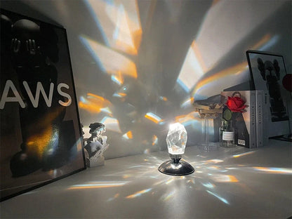 LED Crystal Night Light with remote control and 16 color options on a bedside table