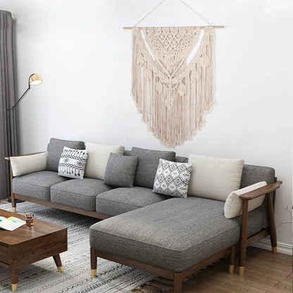 Beige hand woven cotton tapestry 115x100cm hanging on living room wall, textured weave detail