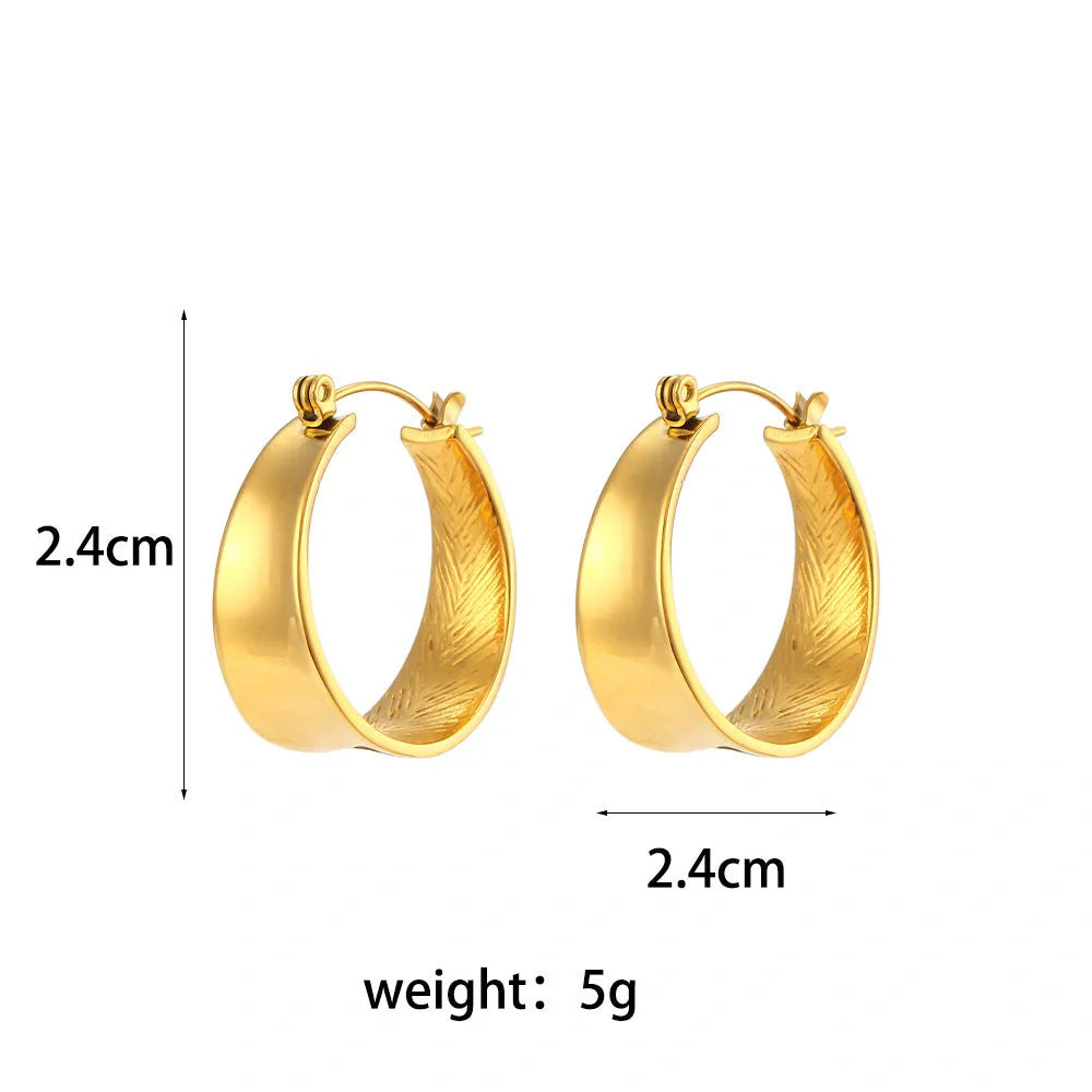 Geometric gradient gold earrings with ellipse design, perfect for women seeking modern elegance