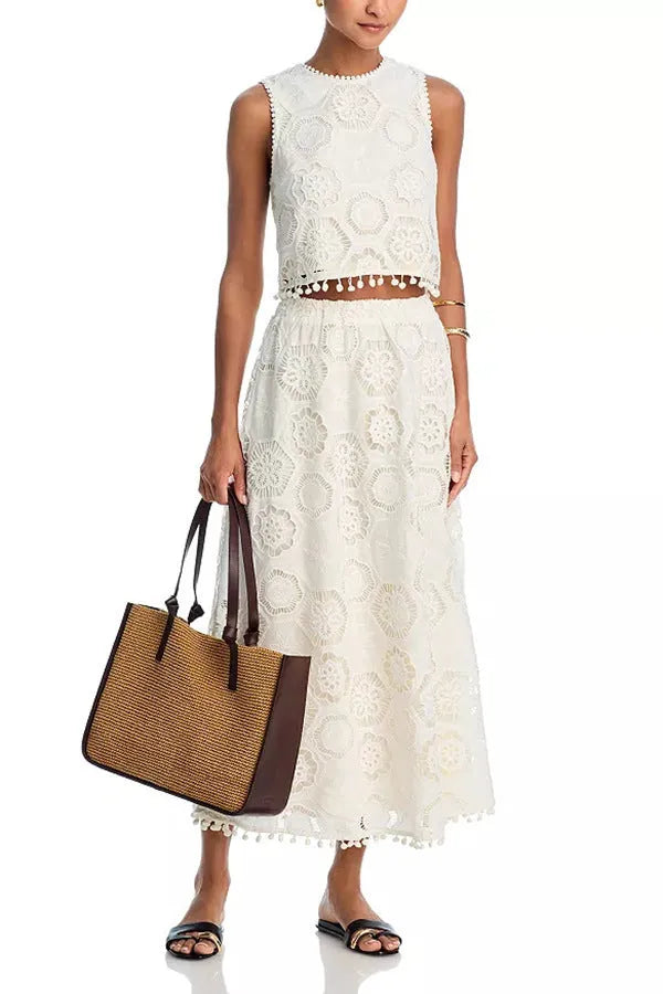 White women's sleeveless top and embroidered long skirt suit with retro art styling