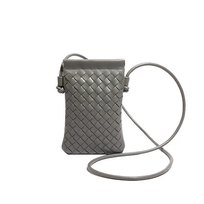 Vertical square vintage weave crossbody bag in multiple colours showing internal dark cell phone pocket.