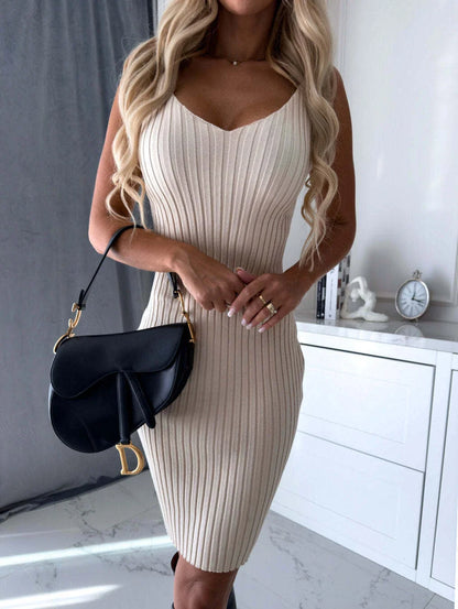 A stylish two-piece outfit featuring a long-sleeved striped top and a flattering suspender skirt in various colors