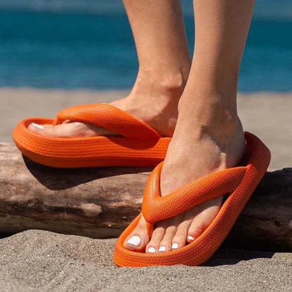 Comfortable beach flip flops with thick EVA sole in various colors for summer wear.