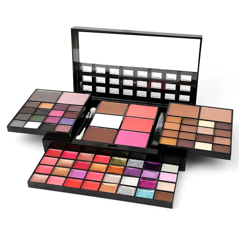 74 colour makeup palette open to show eyeshadows, lip glosses, and face powders with included brushes