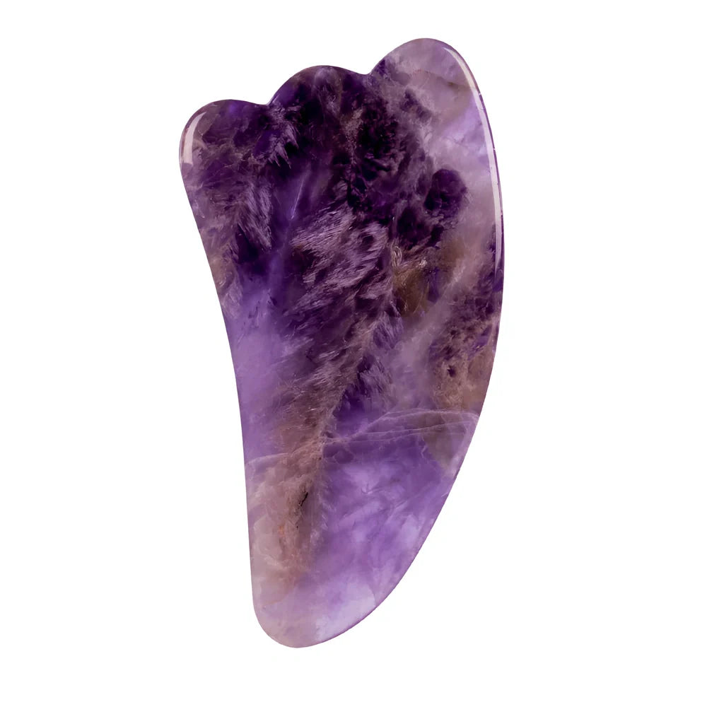 Amethyst facial roller set with heart-shaped gua sha and claw massage tools on white background