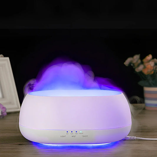 White HOMEFISH aroma diffuser with colour-changing LED light displaying blue hue, remote control beside unit