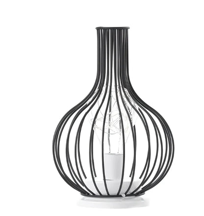 Minimalist hollow table lamp in red wine bottle design with wrought iron construction and warm white LED illumination