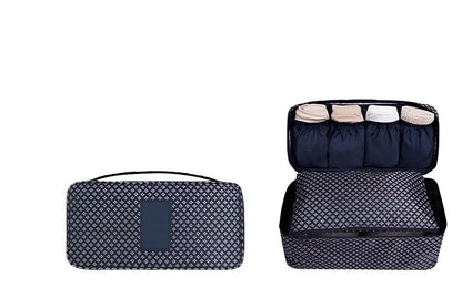 Compact travel underwear organizer in navy blue, 28cm x 14cm x 14.5cm with mesh pockets for packing