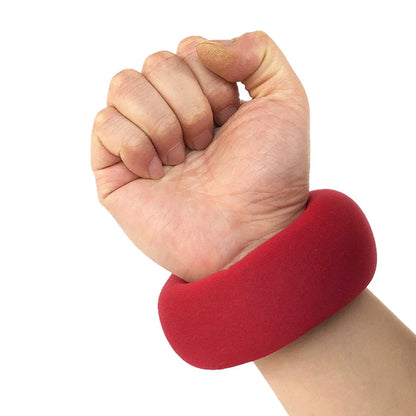 Red neoprene weight-bearing sandbags with reinforced stitching for strength training