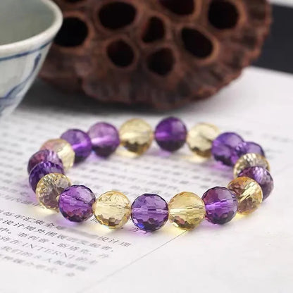 Handmade crystal bracelet with 128-cut gemstone beads and zodiac charm on wrist