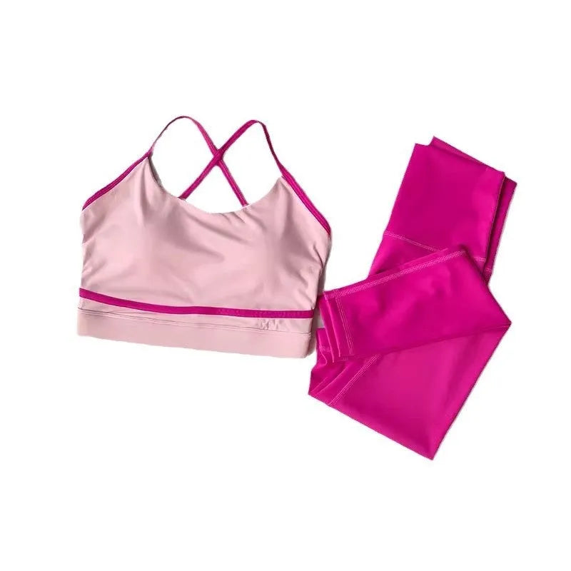 Women's blue and white nylon spandex yoga set with sleeveless tank top and cropped pants.