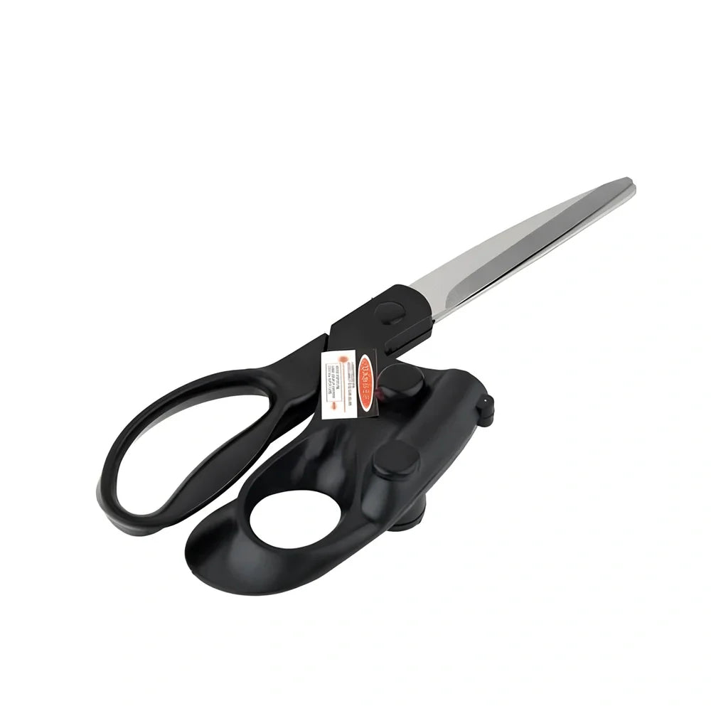 Black laser-guided scissors with red beam cutting straight line on wrapping paper