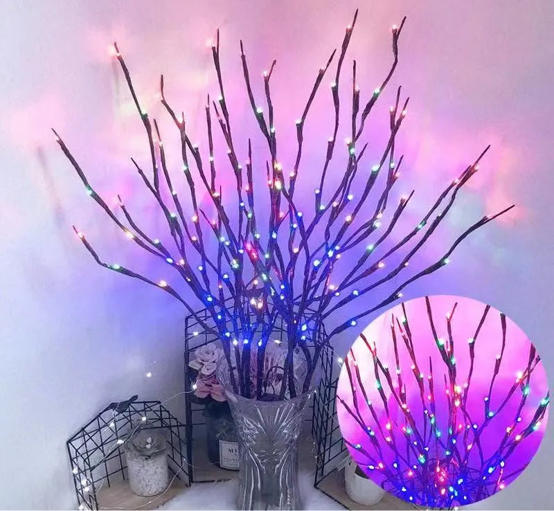 Silver branch LED tree light in a vase with multiple colour change modes including blue, pink, and warm white.