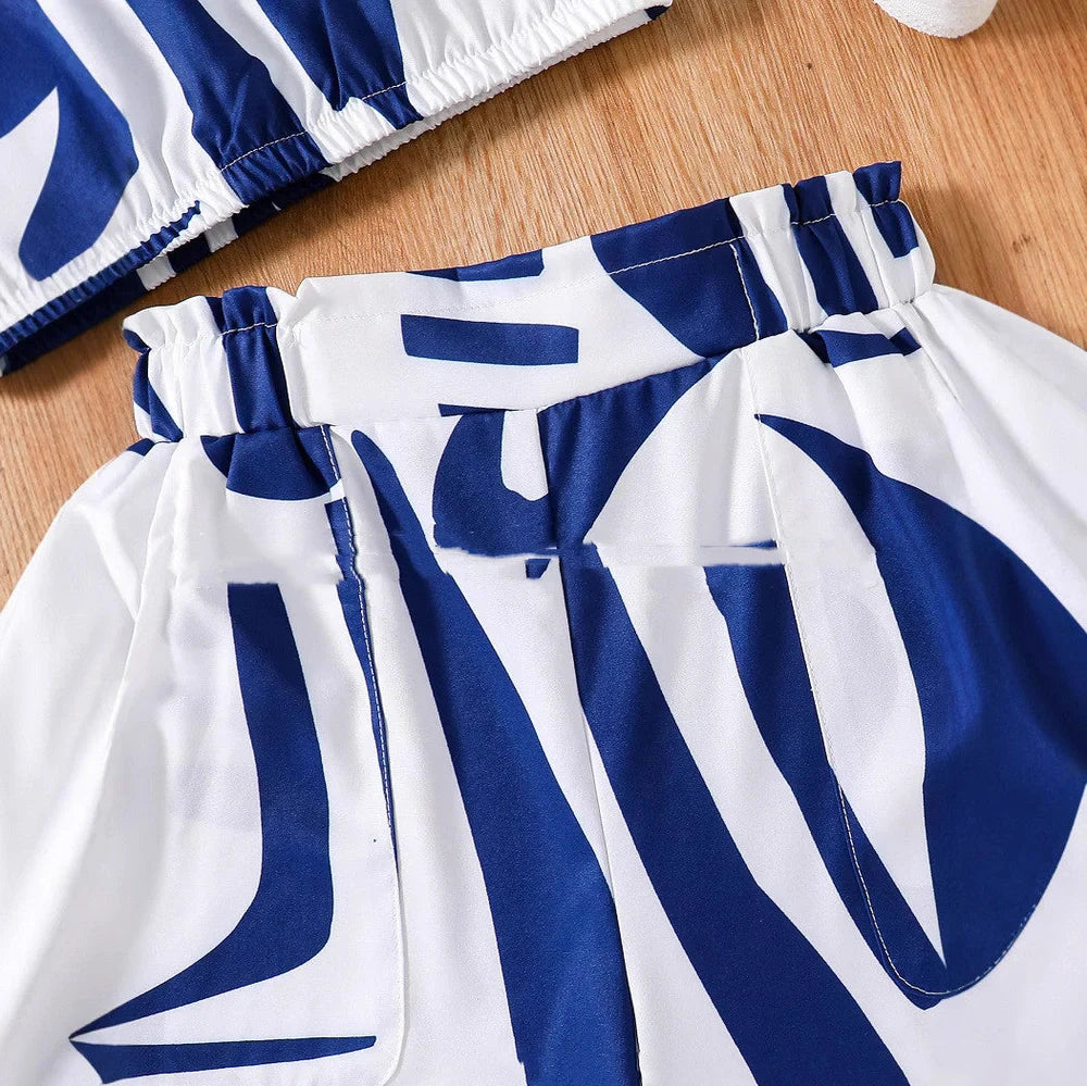 Black and white zebra print short sleeve top with matching wide leg shorts for youth summer wear