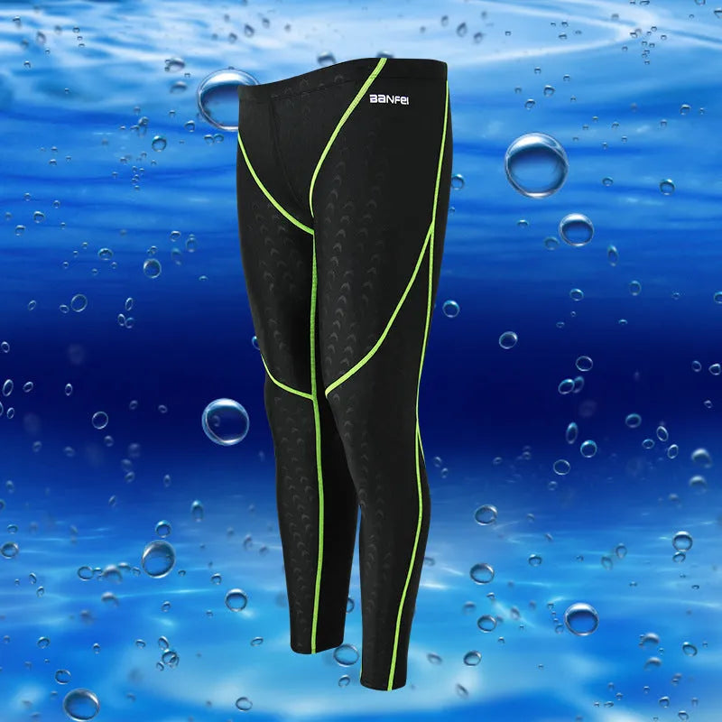 Men's black and grey cropped nylon swimming trunks with mesh lining, laid flat.