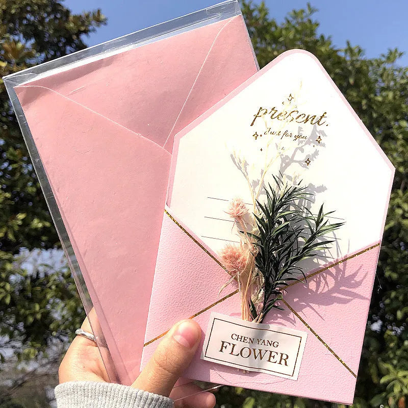 Handmade 3D pop-up greeting card with butterfly shape showing artificial flowers and hot stamping details