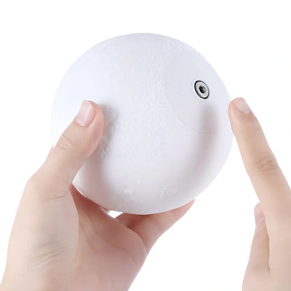 3D printed moon night light with detailed lunar surface and dual-colour LED lighting on beech wood stand