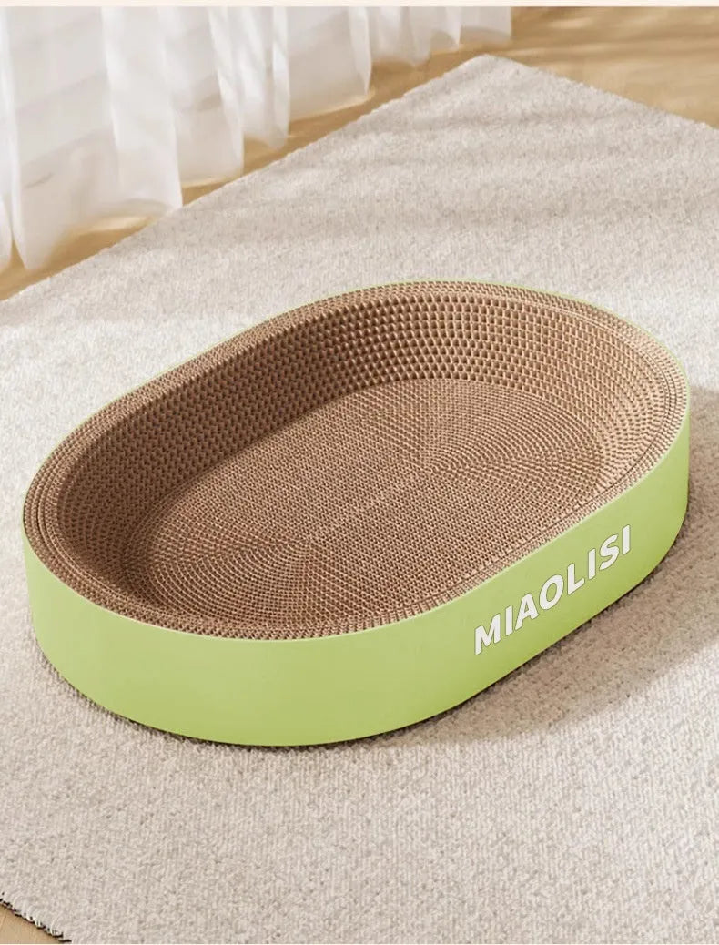 Green oval corrugated paper cat scratch board nest measuring 55cm diameter