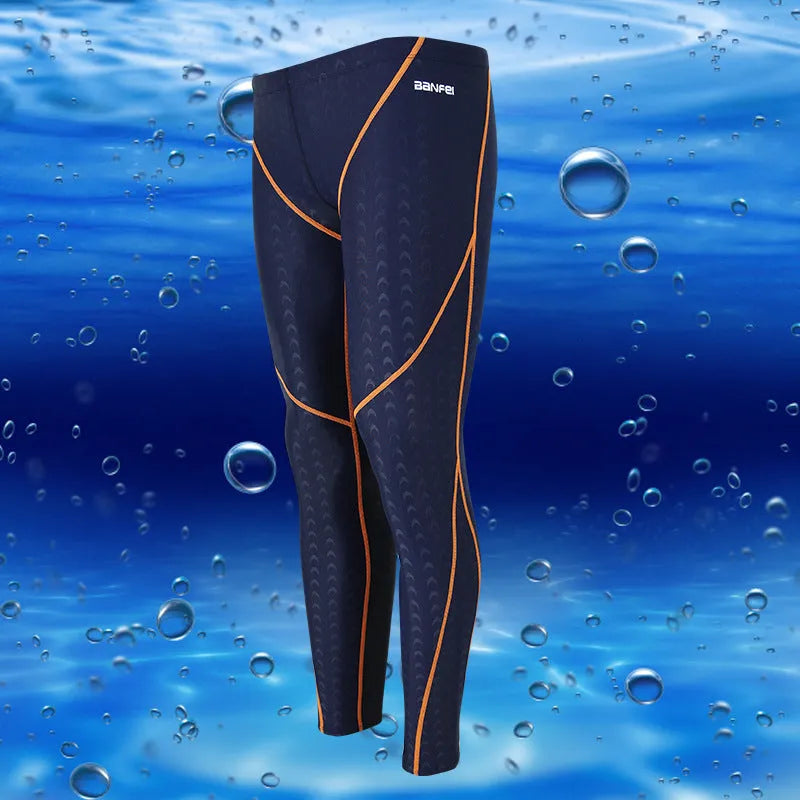 Men's black and grey cropped nylon swimming trunks with mesh lining, laid flat.
