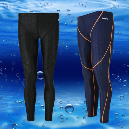 Men's black and grey cropped nylon swimming trunks with mesh lining, laid flat.