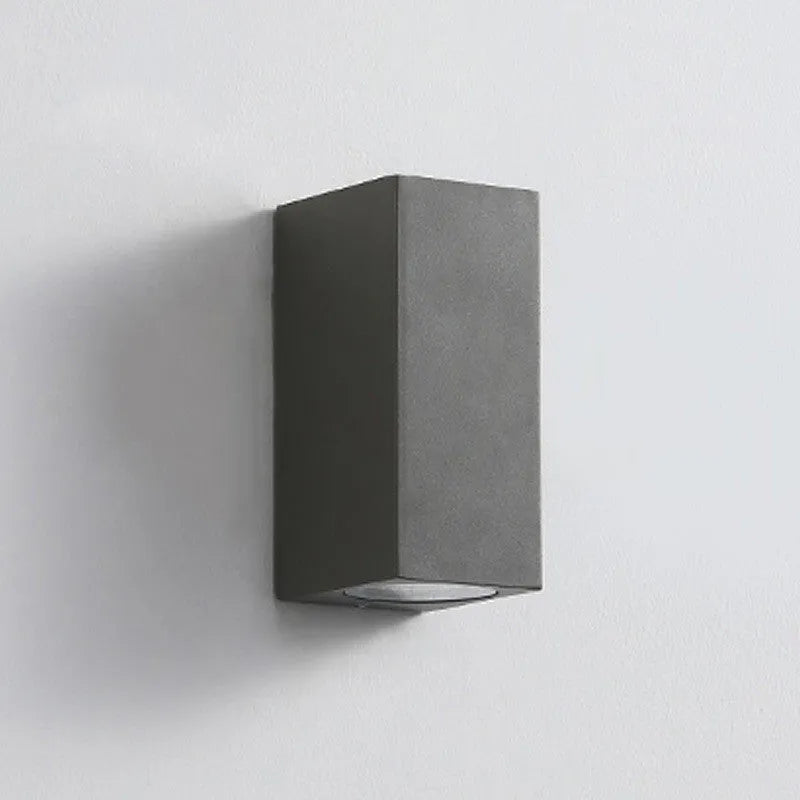Black LED wall lamp with aluminium body and glass shade mounted on wall
