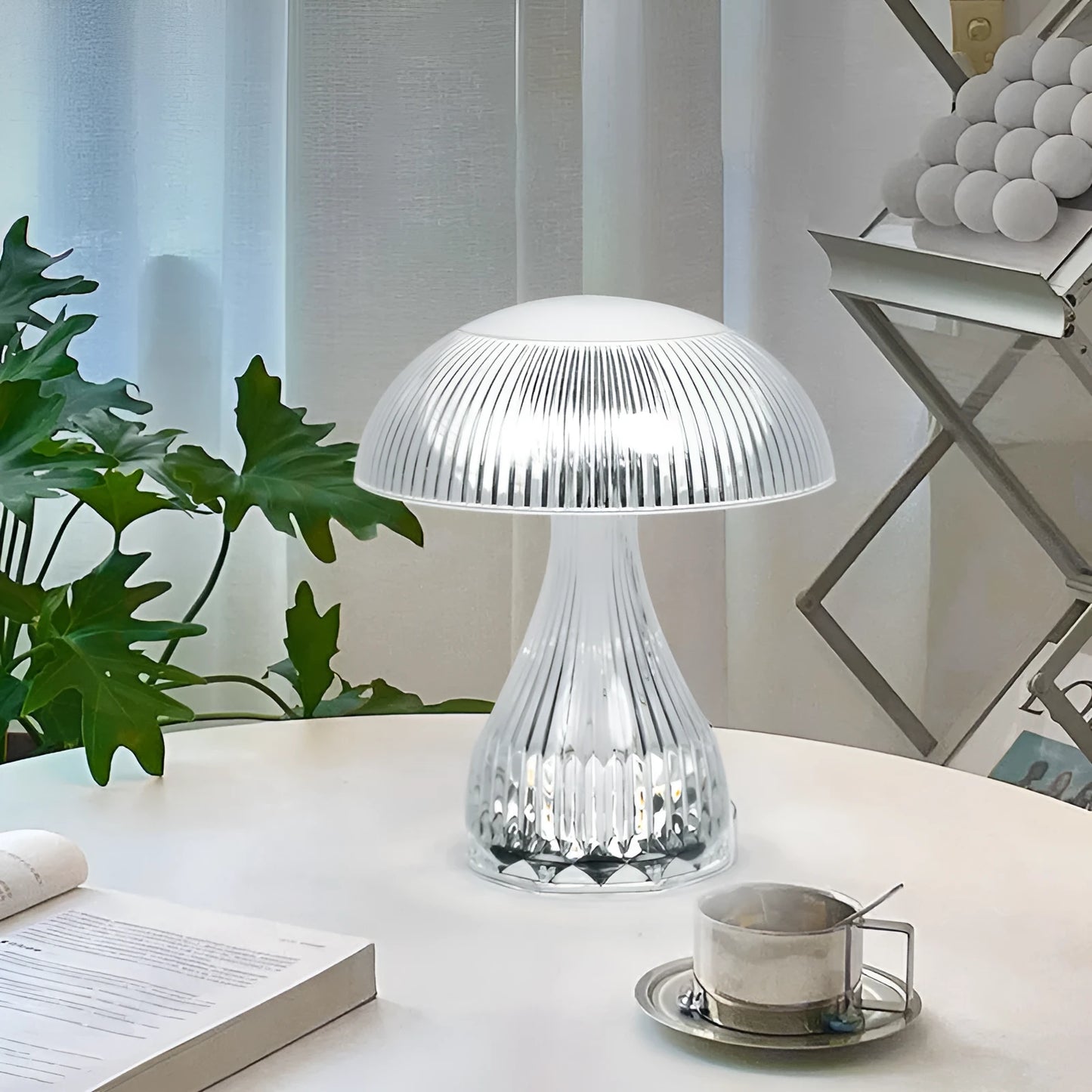 USB rechargeable acrylic table lamp with three colour changing modes on a surface.