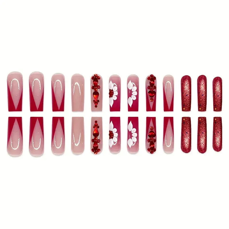 Sweet floral pattern press-on nails with red diamond accents in a long European Square shape.