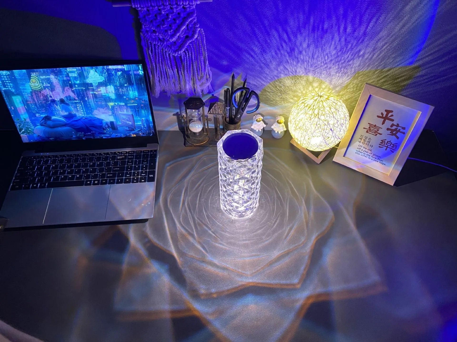 Modern minimalist acrylic crystal rose LED table lamp with touch switch on a wooden table.