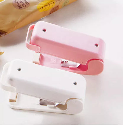 Home Portable Mini Sealing Machine in white and pink with optional magnetic closure
