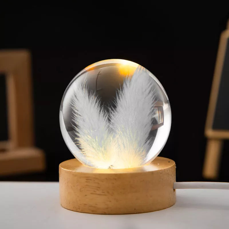 LED Dandelion Crystal Ball Night Light with oak base emitting soft glow