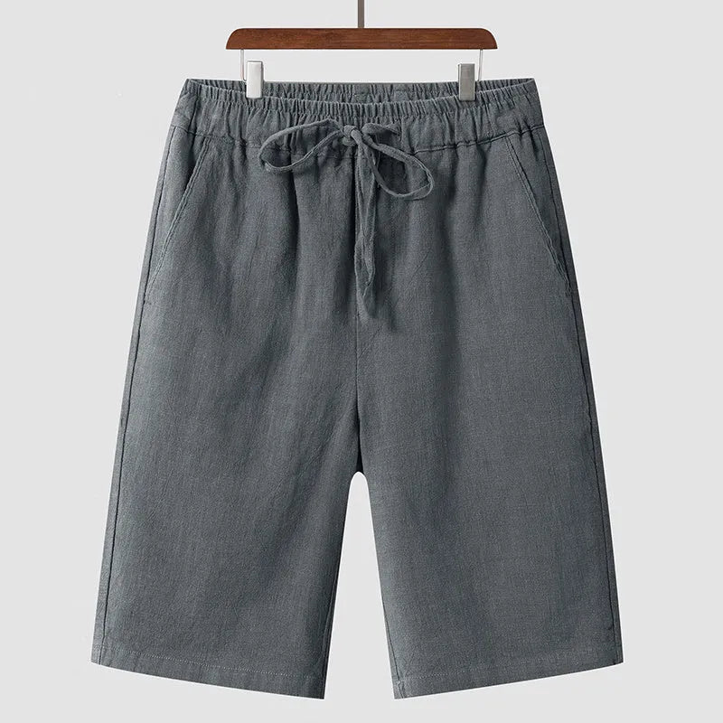 Men's linen casual shorts with elastic waistband in loose cropped design showing beige colour option