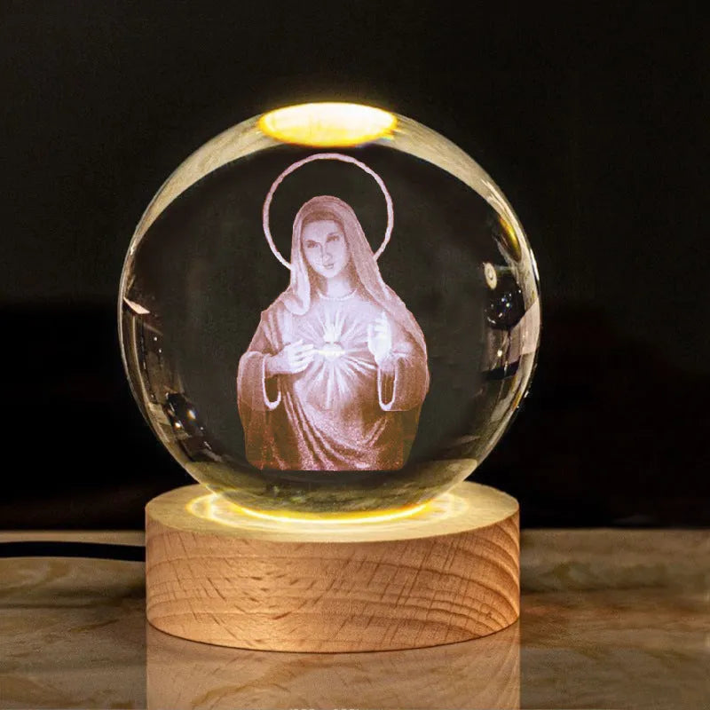 White crystal ball ornament with solid wood warm light base, showing purity engravings like Cross and Maria for desk decor