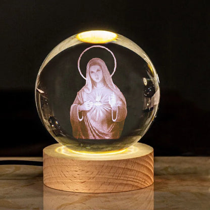 White crystal ball ornament with solid wood warm light base, showing purity engravings like Cross and Maria for desk decor