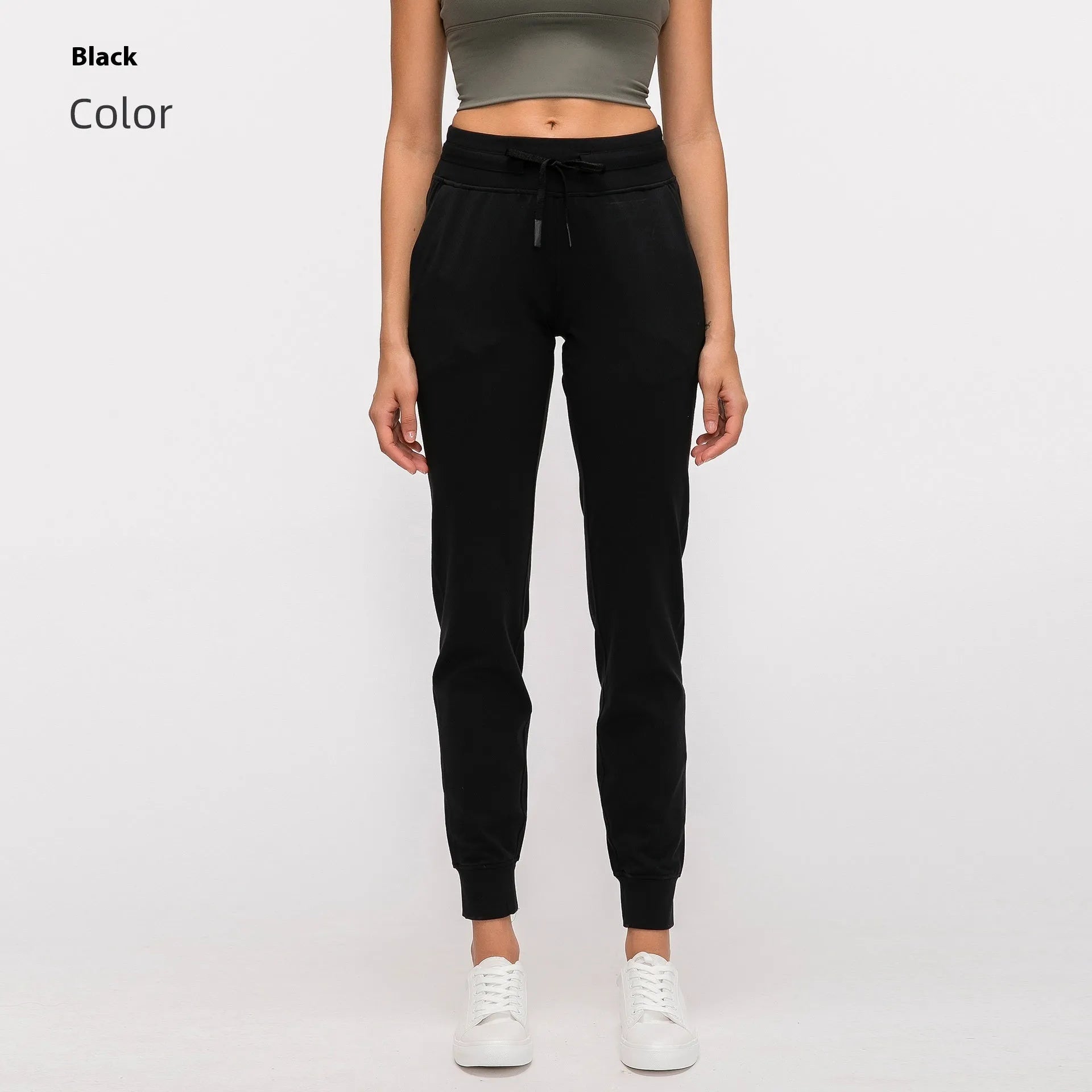Women's high waist yoga pants with drawstring waistband in Belgian blue colour, showing stretch fabric during yoga pose