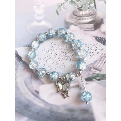Chinese style glass bead bracelet with bamboo joint design on wrist.